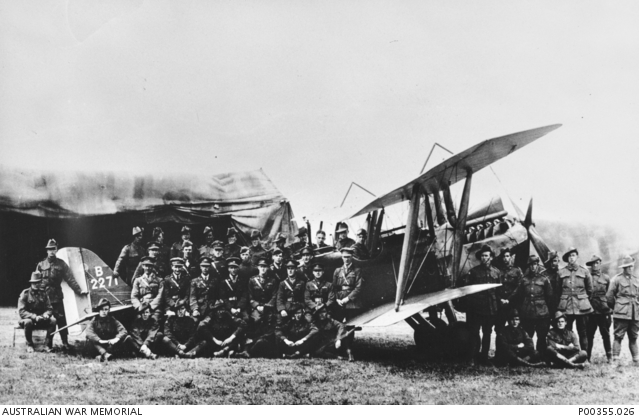 Officers and men of No. 3 Squadron AFC posing infront of a Royal Aircraft Factory R.E.8 