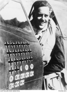 Group Captain Clive Robertson Caldwell, DFC and bar, DSO, commanding officer of No. 80 Fighter Wing, in the cockpit of his Spitfire Mk. VIIIC aircraft featuring victory markings over German, Italian and Japanese aircraft. His final tally was 28.5 confirmed air to air victories - Morotai, New Guinea. 1945 (Photo Source: Australian War Memorial)