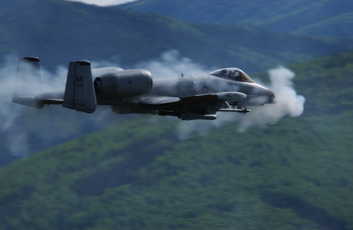 A U.S. Air Force A/OA-10 Thunderbolt II from the 355th Fighter Squadron is surrounded by a cloud of gun smoke as it fires a 30mm GAU-8 Avenger Gatling gun over the Pacific Alaska Range Complex in Alaska on May 29, 2007.  The seven-barrel Gatling gun can  be fired at a rate of 3,900 rounds per minute.  DoD photo by Airman 1st Class Jonathan Snyder, U.S. Air Force.  (Released)