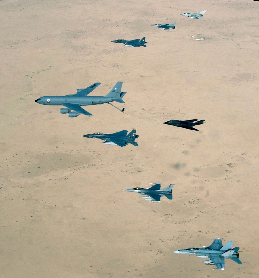 Aircraft of the 379th Air Expeditionary Wing and coalition counterparts fly over the desert during Operation Iraqi Freedom on April 14th, 2003. Aircraft include USAF KC-135 Stratotanker, F-15E Strike Eagle, F-117 Nighthawk and F-16CJ Falcon; British GR.4 Tornado and Australian F/A-18 Hornet