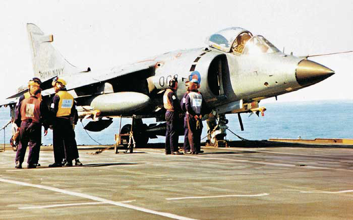 A Royal Navy Sea Harrier prepared for launch from  HMS Ark Royal for a mission over the Balkans circa 1993/94
