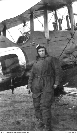 Ray Parer poses beside the oil splattered Airco DH9 at St. Raphael, France on January 20th, 1920 - the rubber connections on the oil and fuel systems had been giving them a lot of trouble on the flight (Photo Source: Australian War Memorial)