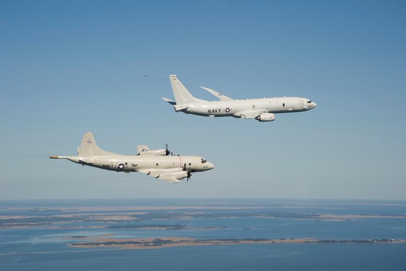 A P-8A Poseidon flies with a P-3C Orion prior to landing at Naval Air Station Patuxent River, Md. on April 10th, 2010