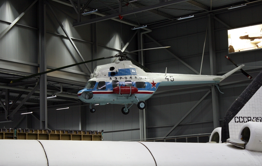 A former Soviet Air Force Mil Mi-2 Hoplite helicopter in Aeroflot livery hangs from the Space Gallery at Technik Museum Speyer Germany