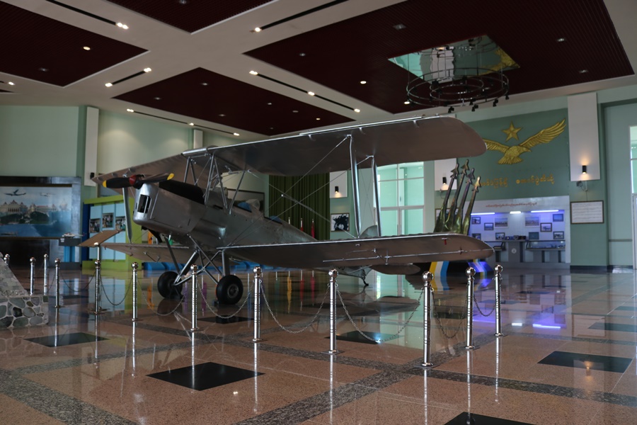 Myanmar Air Force monument behind the de Havilland DH.82 Tiger Moth biplane training aircraft of the Burmese Air Force at the new Defence Services Museum in Nay Pyi Taw