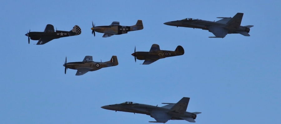 RAAF 2OCU "Classic" F/A-18A Hornets arrived from RAAF Williamtown and flanked a formation of World War Two era piston engine P-40 Kittyhawk and P-51D Mustang fighters at Warbirds Downunder 2018